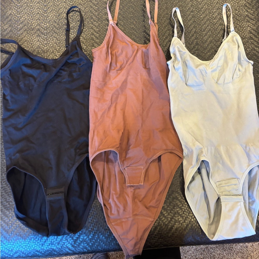 Set of Three Bodysuits in Black, Rust, and Gray